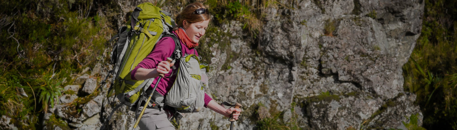 A lady with a Aarn hiking balance pack and front pockets hiking